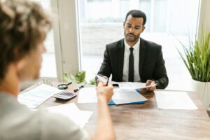 Image of two persons discussing